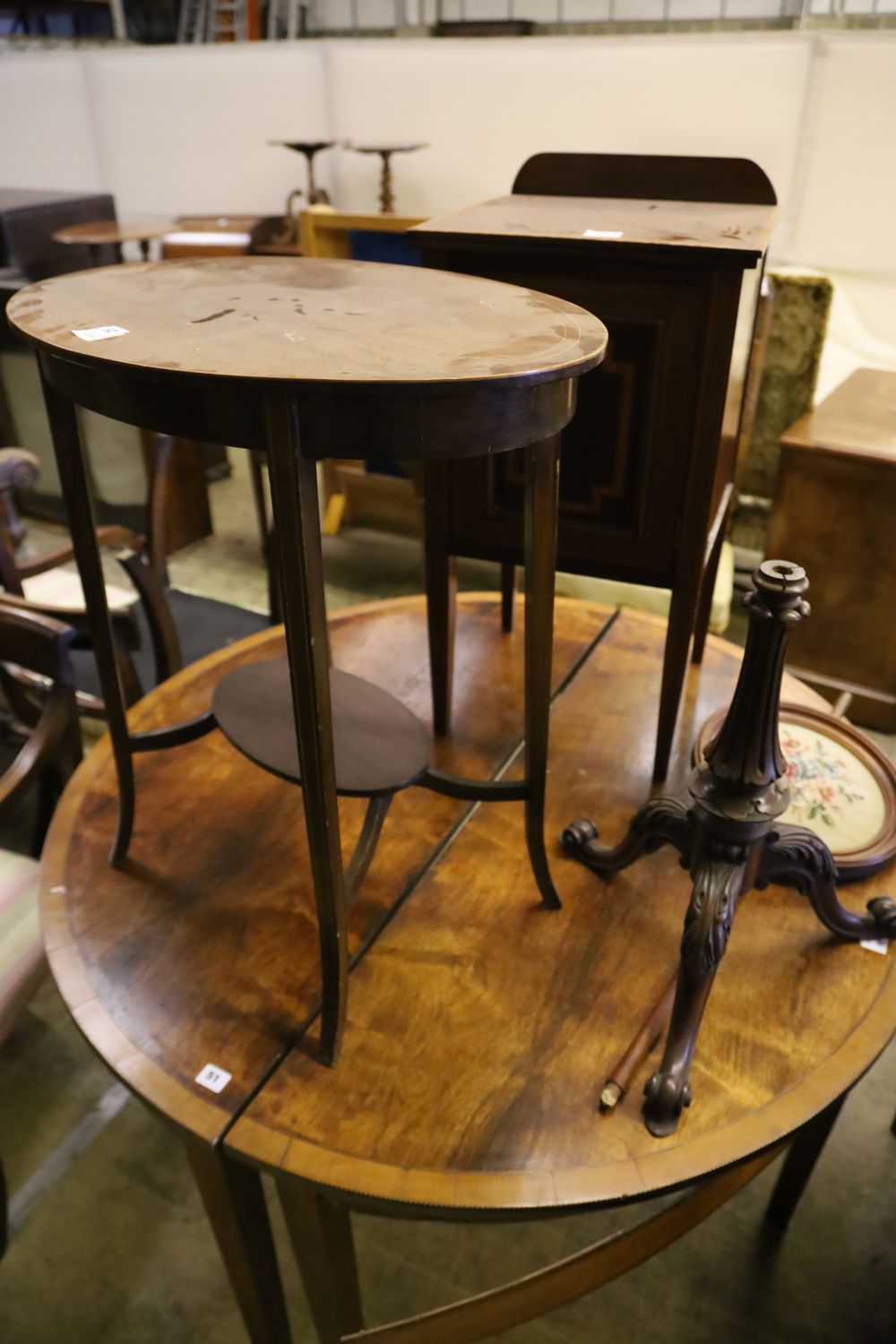 An Edwardian mahogany pot cupboard, an oval occasional table and a Victorian pole screen